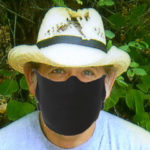 author with a coronavirus mask on